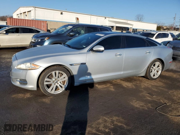 2013 Jaguar XJ Portfolio with VIN SAJWJ2GD3D8V47266, listed as a Copart auction lot 46824695 with 157,151 mi miles and Salvage title. Bid and sale history available at DreamBid. Image 1.
