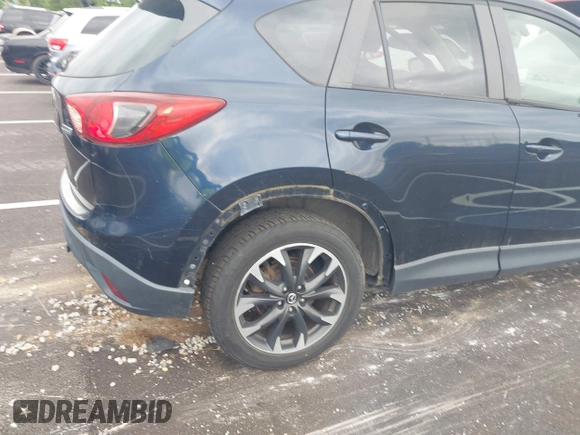 2016 Mazda CX-5 Grand Touring with VIN JM3KE2DYXG0890174, listed as a IAAI auction lot 42157884 with 141,873 mi miles. Bid and sale history available at carsss.com. Image 6.