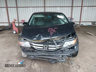 2014 Honda Odyssey Touring with VIN 5FNRL5H98EB095835, listed as a IAAI auction lot 42153412 with 124,131 mi miles and . Bid and sale history available at DreamBid. Image 13.