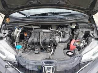 2015 Honda Fit EX-L z VIN 3HGGK5H8XFM733048, wystawiony jako IAAI lot #42267517 z przebiegiem Nie podano mil oraz . Historia ofert i sprzedaży dostępna na DreamBid. Obrazek 10.