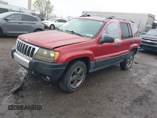 2004 Jeep Grand Cherokee Laredo with VIN 1J4GW48S94C151816, listed as a IAAI auction lot 41983332 with 151,227 mi miles. Bid and sale history available at carsss.com. Image 17.