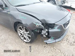 2015 Mazda 6 i Grand Touring with VIN JM1GJ1W56F1207077, listed as a IAAI auction lot 41734641 with 109,447 mi miles and . Bid and sale history available at DreamBid. Image 17.