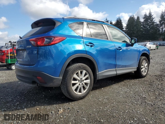 2014 Mazda CX-5 Touring with VIN JM3KE4CY3E0381134, listed as a Copart auction lot 52115015 with 52,162 mi miles and Salvage Title. Bid and sale history available at carsss.com. Image 3.