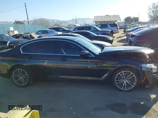 2019 BMW 5 Series 530e with VIN WBAJA9C57KB399541, listed as a IAAI auction lot 41656775 with 96,523 mi miles and . Bid and sale history available at DreamBid. Image 13.