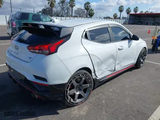 2019 Hyundai Veloster N with VIN KMHT36AH6KU001916, listed as a IAAI auction lot 41577775 with 77,471 mi miles. Bid and sale history available at carsss.com. Image 4.