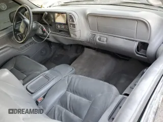 1999 Chevrolet Tahoe with VIN 3GNEC18R1XG143882, listed as a Copart auction lot 42177005 with 130,368 mi miles and Salvage title. Bid and sale history available at DreamBid. Image 8.