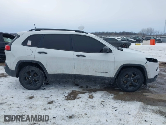2016 Jeep Cherokee Altitude with VIN 1C4PJLAB4GW376723, listed as a IAAI auction lot 41593248 with 96,940 mi miles and . Bid and sale history available at DreamBid. Image 13.