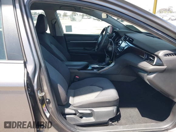 2019 Toyota Camry LE with VIN 4T1B11HK8KU204599, listed as a IAAI auction lot 42096889 with 76,518 mi miles and . Bid and sale history available at DreamBid. Image 5.