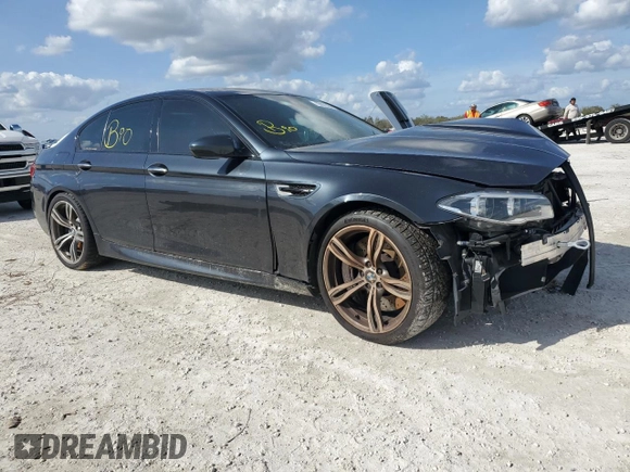 2014 BMW M5 with VIN WBSFV9C54ED097865, listed as a Copart auction lot 79897384 with 0 mi miles and Salvage Title. Bid and sale history available at carsss.com. Image 4.