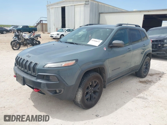 2015 Jeep Cherokee Trailhawk with VIN 1C4PJMBS0FW524479, listed as a IAAI auction lot 41908871 with 118,825 mi miles and . Bid and sale history available at DreamBid. Image 2.