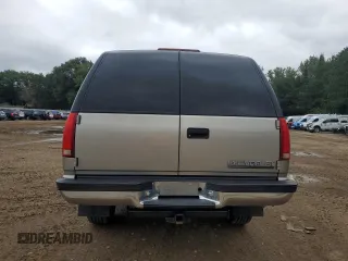 1999 Chevrolet Suburban with VIN 1GNGK26J0XJ439859, listed as a Copart auction lot 69076004 with 277,201 mi miles and Salvage Title. Bid and sale history available at carsss.com. Image 6.