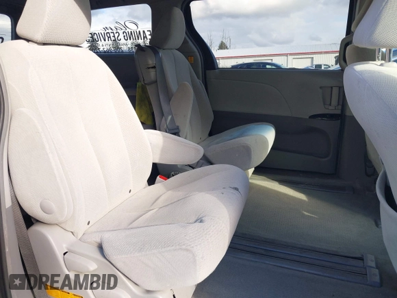 2012 Toyota Sienna with VIN 5TDKA3DC6CS015762, listed as a IAAI auction lot 41529216 with 219,136 mi miles and . Bid and sale history available at DreamBid. Image 8.