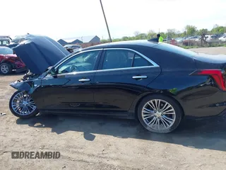2021 Cadillac CT4 Premium Luxury z VIN 1G6DF5RK8M0121711, wystawiony jako IAAI lot #42197628 z przebiegiem Nie podano mil oraz . Historia ofert i sprzedaży dostępna na DreamBid. Obrazek 14.