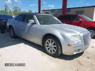 2005 Chrysler 300 with VIN 2C3AA63HX5H125777, listed as a IAAI auction lot 41843281 with 115,034 mi miles. Bid and sale history available at carsss.com. Image 1.
