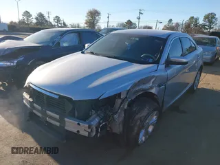 2014 Ford Taurus SEL z VIN 1FAHP2E87EG121069, wystawiony jako IAAI lot #41030422 z przebiegiem 138 043 mil mil oraz . Historia ofert i sprzedaży dostępna na DreamBid. Obrazek 6.