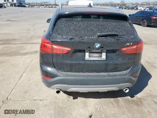 2018 BMW X1 sDrive28i with VIN WBXHU7C31J5H39068, listed as a Copart auction lot 49018985 with 100,611 mi miles and Salvage Title. Bid and sale history available at carsss.com. Image 6.