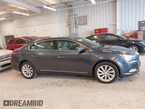 2014 Buick LaCrosse Leather with VIN 1G4GB5G39EF132695, listed as a IAAI auction lot 41728596 with 124,639 mi miles and . Bid and sale history available at DreamBid. Image 13.