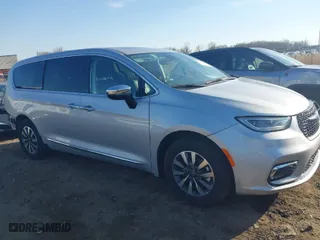 2023 Chrysler Pacifica Hybrid Limited with VIN 2C4RC1S72PR588627, listed as a IAAI auction lot 42063631 with 52,799 mi miles. Bid and sale history available at carsss.com. Image 1.