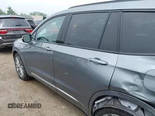 2021 Cadillac XT6 Sport with VIN 1GYKPGRS6MZ128112, listed as a IAAI auction lot 42415342 with 57,680 mi miles and . Bid and sale history available at DreamBid. Image 14.