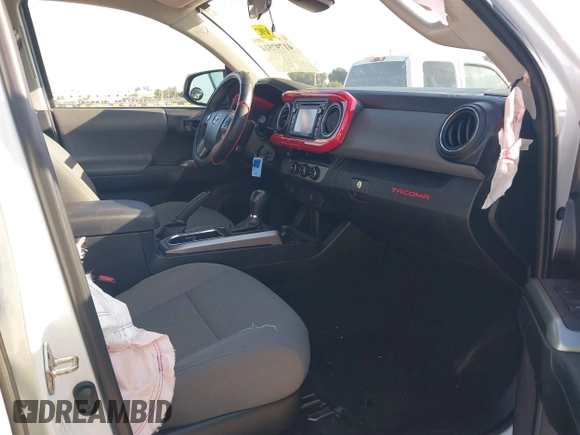 2018 Toyota Tacoma SR with VIN 5TFAX5GN2JX128621, listed as a IAAI auction lot 41797514 with 216,251 mi miles and . Bid and sale history available at DreamBid. Image 5.