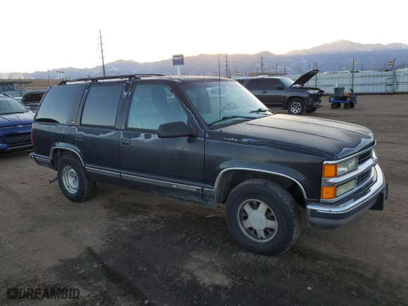 1999 Chevrolet Tahoe with VIN 1GNEC13R4XJ568244, listed as a Copart auction lot 85397504 with 111,327 mi miles and Clean Title. Bid and sale history available at carsss.com. Image 4.