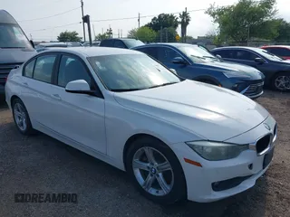 2015 BMW 3 Series 320i with VIN WBA3B1G5XFNT05903, listed as a IAAI auction lot 42063574 with 1 mi miles. Bid and sale history available at carsss.com. Image 1.