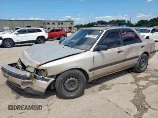 1994 Mazda Protege z VIN JM1BG2243R0808453, wystawiony jako Copart lot #60037125 z przebiegiem 232 962 mil mil oraz Szkoda całkowita • Salvage title. Historia ofert i sprzedaży dostępna na DreamBid. Obrazek 1.