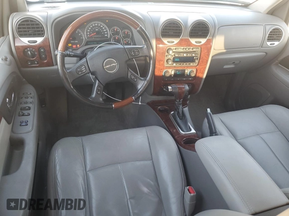 2006 GMC Envoy Denali with VIN 1GKET63M662228794, listed as a Copart auction lot 70802804 with 134,323 mi miles and Salvage Title. Bid and sale history available at DreamBid. Image 8.