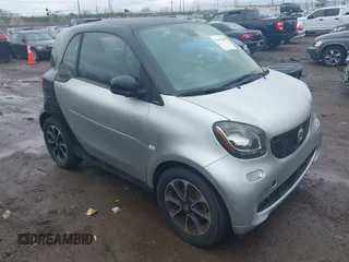 2016 Smart fortwo Passion z VIN WMEFJ5DA2GK069795, wystawiony jako IAAI lot #41894208 z przebiegiem 153 339 mil mil oraz . Historia ofert i sprzedaży dostępna na DreamBid. Obrazek 1.