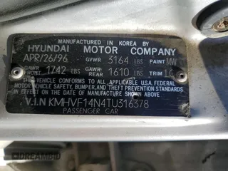 1996 Hyundai Accent z VIN KMHVF14N4TU316378, wystawiony jako Copart lot #88981945 z przebiegiem 128 650 mil mil oraz Tytuł czysty. Historia ofert i sprzedaży dostępna na DreamBid. Obrazek 12.