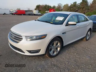 2015 Ford Taurus SEL with VIN 1FAHP2E82FG202143, listed as a IAAI auction lot 42053737 with 113,839 mi miles and . Bid and sale history available at carsss.com. Image 2.