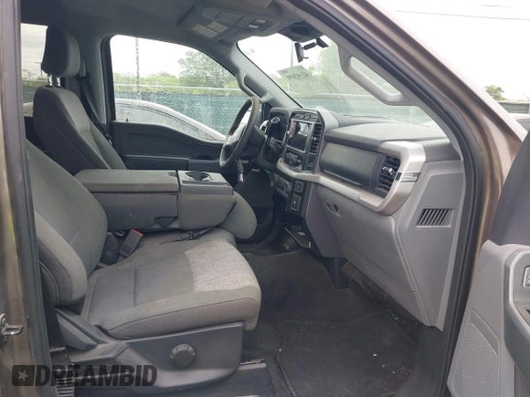 2023 Ford F-150 XL with VIN 1FTFW1E81PFB71702, listed as a IAAI auction lot 42102699 with 57,007 mi miles. Bid and sale history available at carsss.com. Image 5.