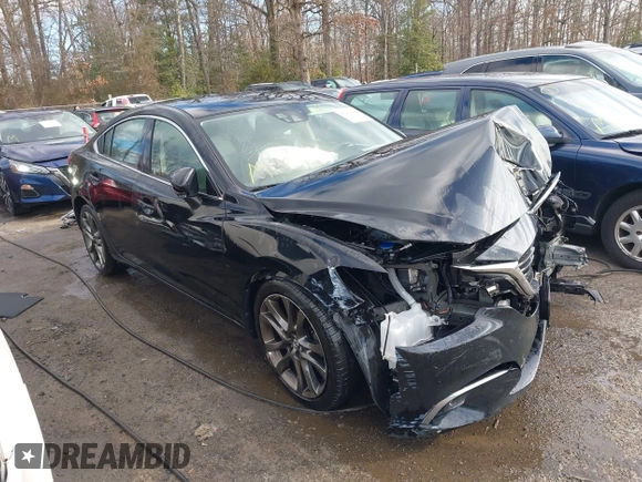 2016 Mazda 6 i Grand Touring with VIN JM1GJ1W54G1454115, listed as a IAAI auction lot 41203298 with 104,632 mi miles and . Bid and sale history available at DreamBid. Image 1.