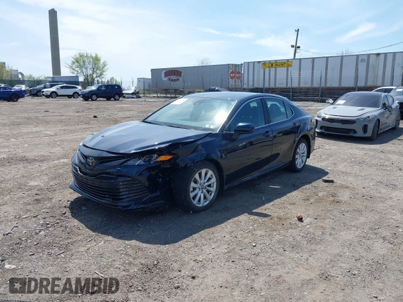 2019 Toyota Camry LE with VIN 4T1B11HK6KU276644, listed as a IAAI auction lot 42037249 with 23,677 mi miles and . Bid and sale history available at DreamBid. Image 17.
