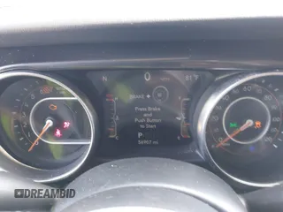 2020 Jeep Wrangler Unlimited Sahara z VIN 1C4HJXEN6LW106869, wystawiony jako IAAI lot #42390113 z przebiegiem 56 907 mil mil oraz . Historia ofert i sprzedaży dostępna na DreamBid. Obrazek 7.