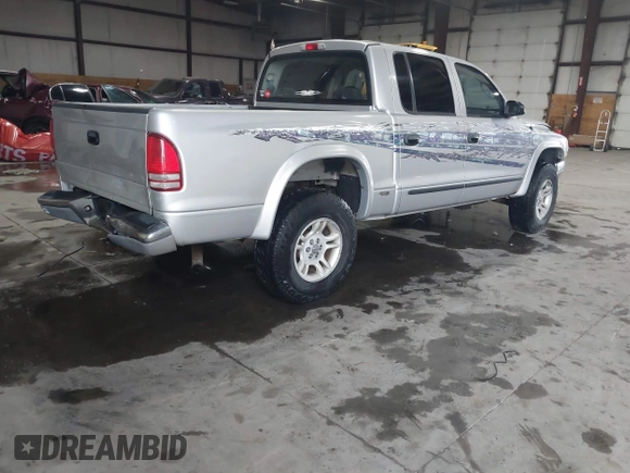 2004 Dodge Dakota SLT with VIN 1D7HG48N64S523528, listed as a IAAI auction lot 41199575 with 261,239 mi miles. Bid and sale history available at carsss.com. Image 4.