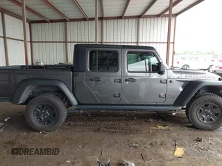 2022 Jeep Gladiator Mojave z VIN 1C6JJTEG8NL182360, wystawiony jako IAAI lot #42194516 z przebiegiem 67 658 mil mil oraz . Historia ofert i sprzedaży dostępna na DreamBid. Obrazek 13.