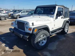2005 Jeep Wrangler SE with VIN 1J4FA29S95P363770, listed as a IAAI auction lot 41362056 with 140,540 mi miles. Bid and sale history available at carsss.com. Image 2.