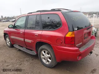 2003 GMC Envoy SLE with VIN 1GKDT13S932334925, listed as a IAAI auction lot 42071477 with 232,935 mi miles. Bid and sale history available at carsss.com. Image 3.