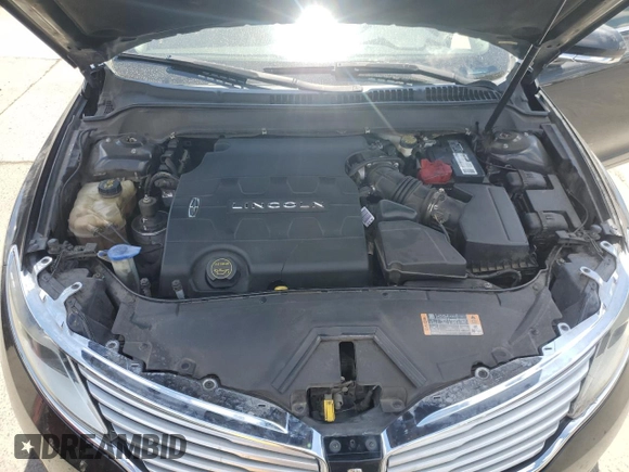 2014 Lincoln MKZ z VIN 3LN6L2GK3ER828065, wystawiony jako Copart lot #56925665 z przebiegiem 187 050 mil mil oraz Szkoda całkowita • Salvage title. Historia ofert i sprzedaży dostępna na DreamBid. Obrazek 11.