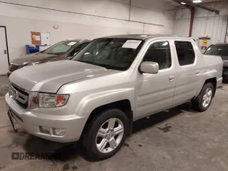 2009 Honda Ridgeline RTL with VIN 2HJYK16519H000129, listed as a IAAI auction lot 41891810 with 186,124 mi miles. Bid and sale history available at carsss.com. Image 2.