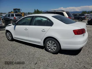 2014 Volkswagen Jetta S with VIN 3VW2K7AJ2EM303673, listed as a Copart auction lot 62909235 with 69,592 mi miles and Salvage title. Bid and sale history available at DreamBid. Image 2.