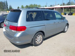 2009 Honda Odyssey EX-L with VIN 5FNRL38779B013943, listed as a IAAI auction lot 42119422 with 147,285 mi miles. Bid and sale history available at carsss.com. Image 4.
