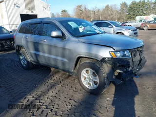 2015 Jeep Grand Cherokee Laredo with VIN 1C4RJFAG9FC775004, listed as a IAAI auction lot 41754534 with 116,893 mi miles. Bid and sale history available at carsss.com. Image 1.
