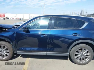 2020 Mazda CX-5 Grand Touring with VIN JM3KFADM6L1830093, listed as a IAAI auction lot 41699672 with 66,769 mi miles. Bid and sale history available at carsss.com. Image 15.