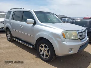 2011 Honda Pilot Touring z VIN 5FNYF3H90BB006634, wystawiony jako IAAI lot #42388390 z przebiegiem 218 475 mil mil oraz . Historia ofert i sprzedaży dostępna na DreamBid. Obrazek 1.