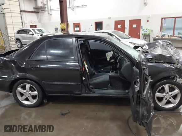 2003 Mazda Protege DX with VIN JM1BJ226431112902, listed as a IAAI auction lot 41939907 with 184,618 mi miles and . Bid and sale history available at DreamBid. Image 14.