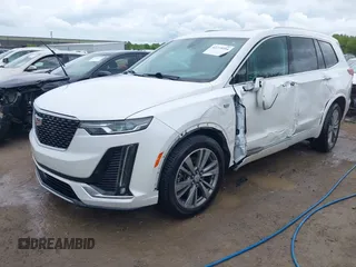 2021 Cadillac XT6 Premium Luxury z VIN 1GYKPDRS0MZ141453, wystawiony jako IAAI lot #42215954 z przebiegiem 144 245 mil mil oraz . Historia ofert i sprzedaży dostępna na DreamBid. Obrazek 2.