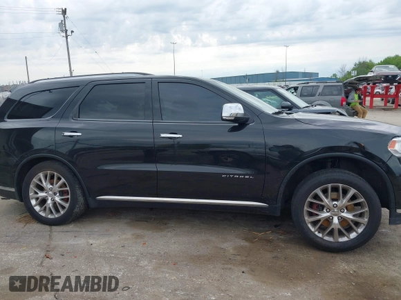 2014 Dodge Durango Citadel with VIN 1C4RDJEGXEC524883, listed as a IAAI auction lot 42357919 with 205,100 mi miles and . Bid and sale history available at DreamBid. Image 14.