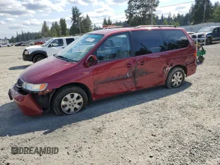 2004 Honda Odyssey EX-L with VIN 5FNRL18714B106129, listed as a Copart auction lot 65805175 with 75,055 mi miles and Salvage title. Bid and sale history available at DreamBid. Image 1.